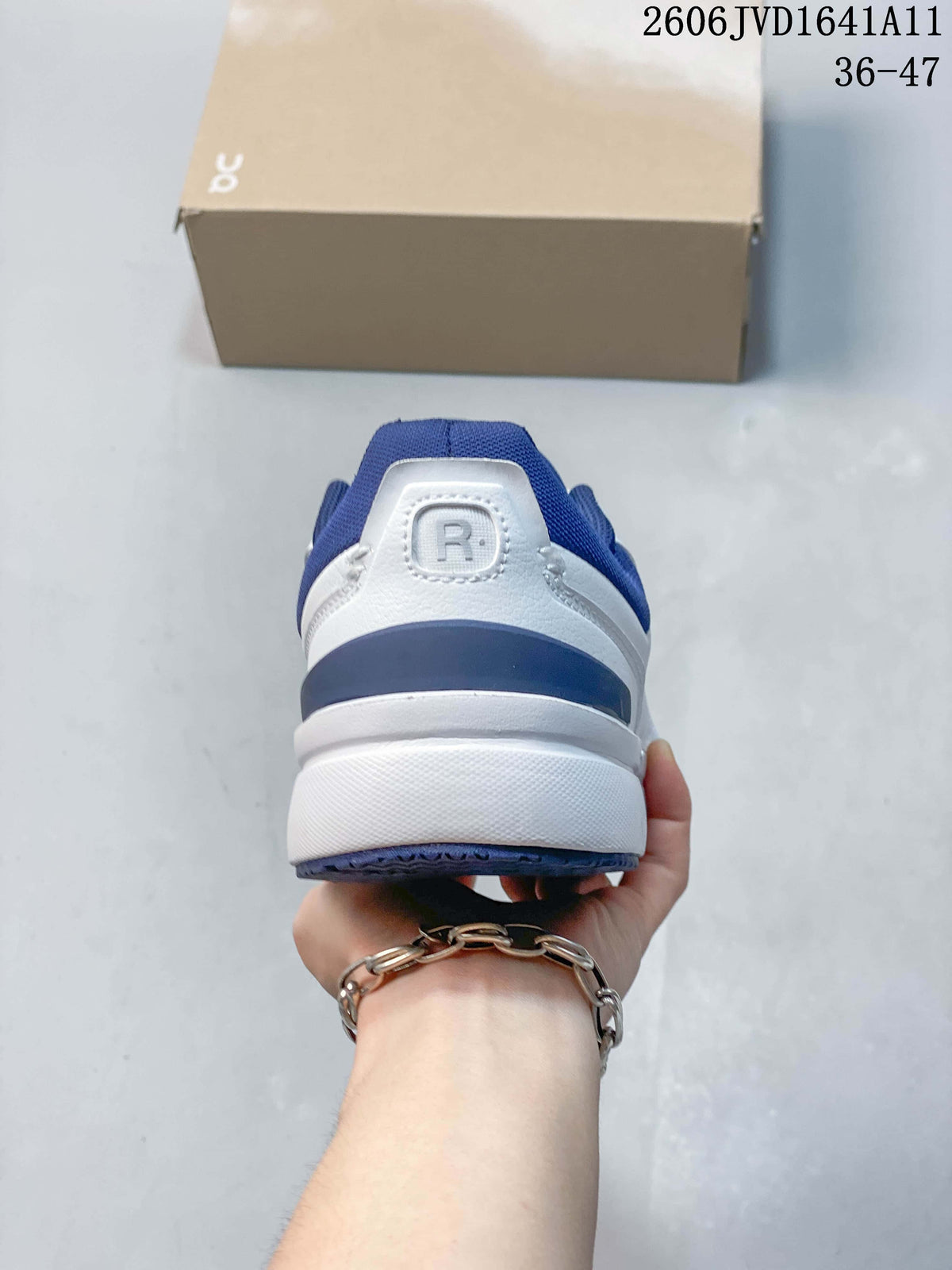 Rear view showing the blue heel accent and padded collar on a white sneaker.