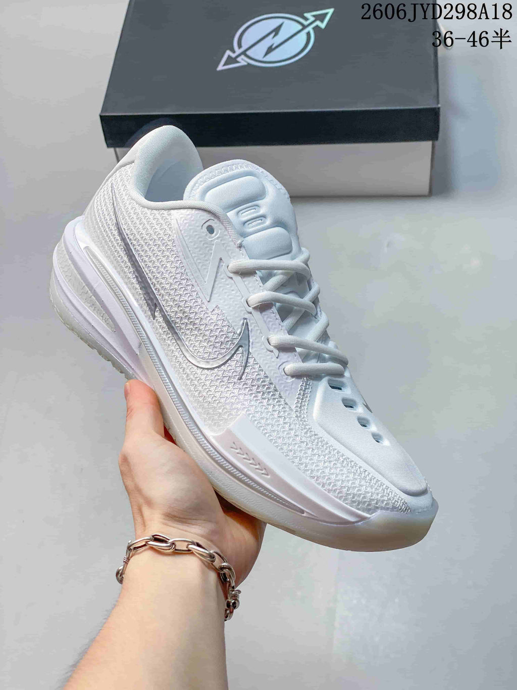All-white Nike Air Zoom GT Cut low-top shoe.