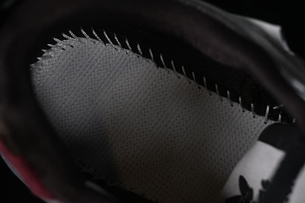 Close-up inside the shoe showing the footbed and interior stitching.