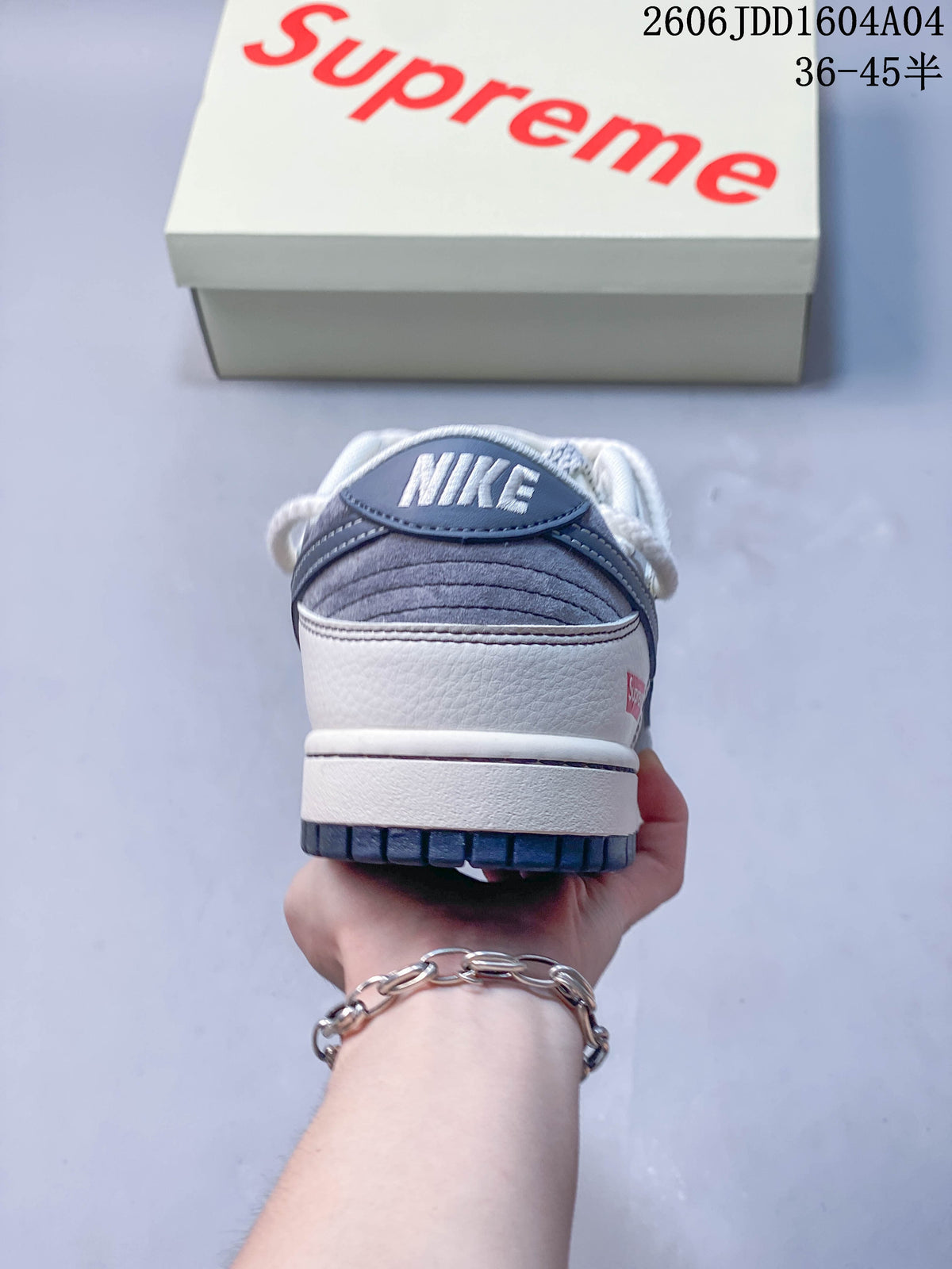 Rear view of the gray and white Nike SB Dunk Low sneaker
