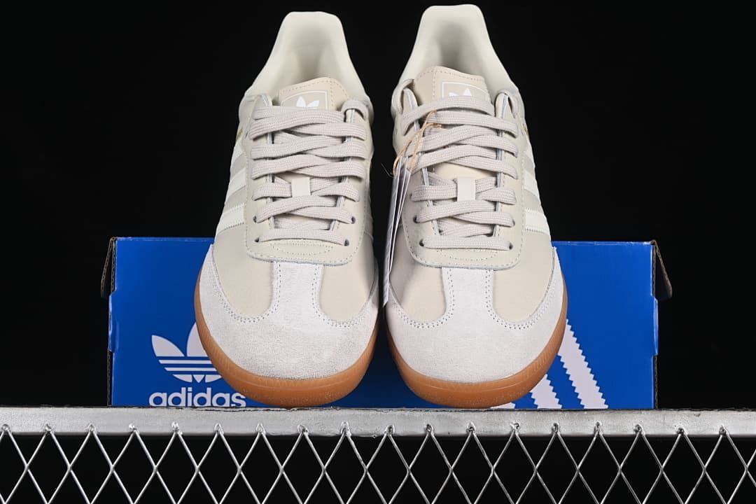Front view of the pair displayed on an adidas shoebox