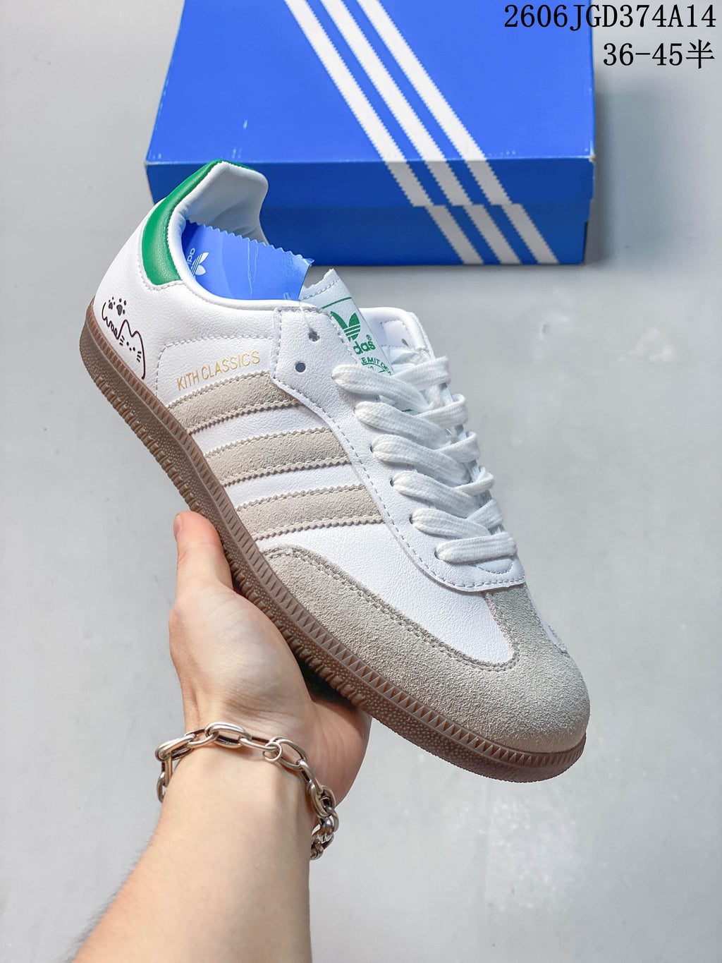 Angled side view showing the sneaker’s three stripes, small heel graphic, KITH CLASSICS text, and gum-colored sole.