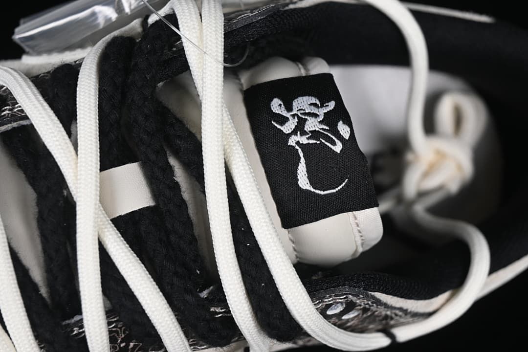 Close-up of the tongue label and white laces