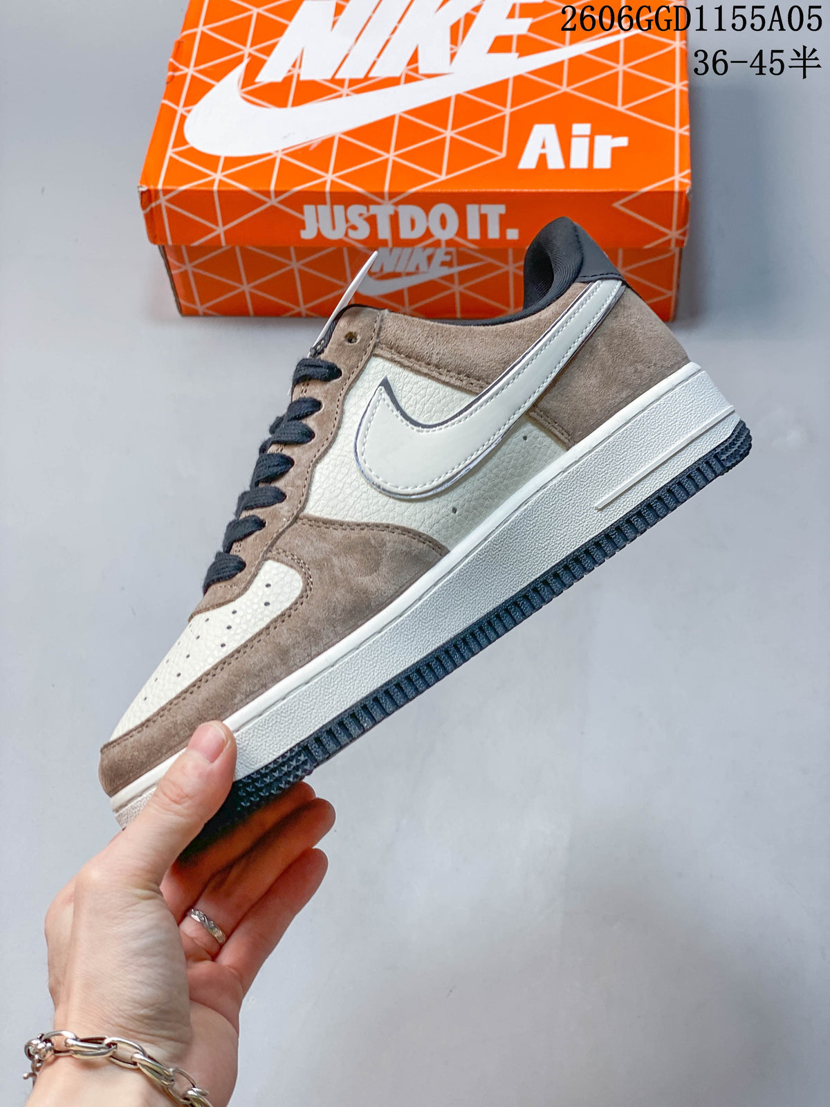 Side view of the gray and white low-top sneaker