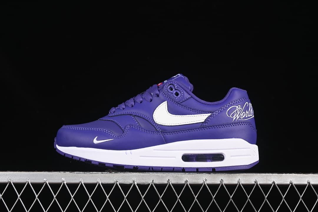 Side view of a purple Nike Air Max 1 sneaker with white Swoosh and visible Air unit
