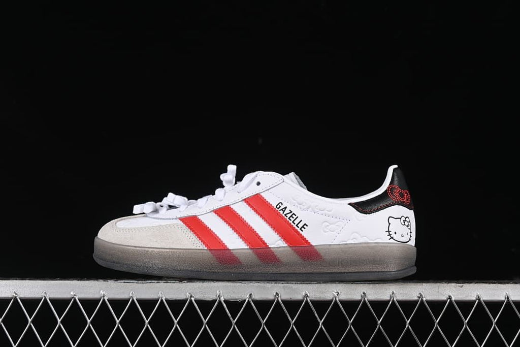 Side profile of the white and red Hello Kitty Gazelle Indoor sneaker.