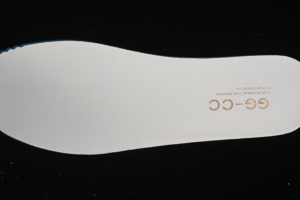White shoe insole with GG-CC lettering.