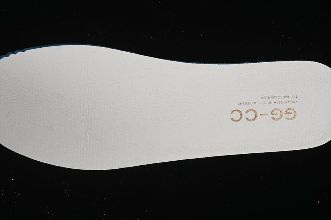 White shoe insole with GG-CC lettering.
