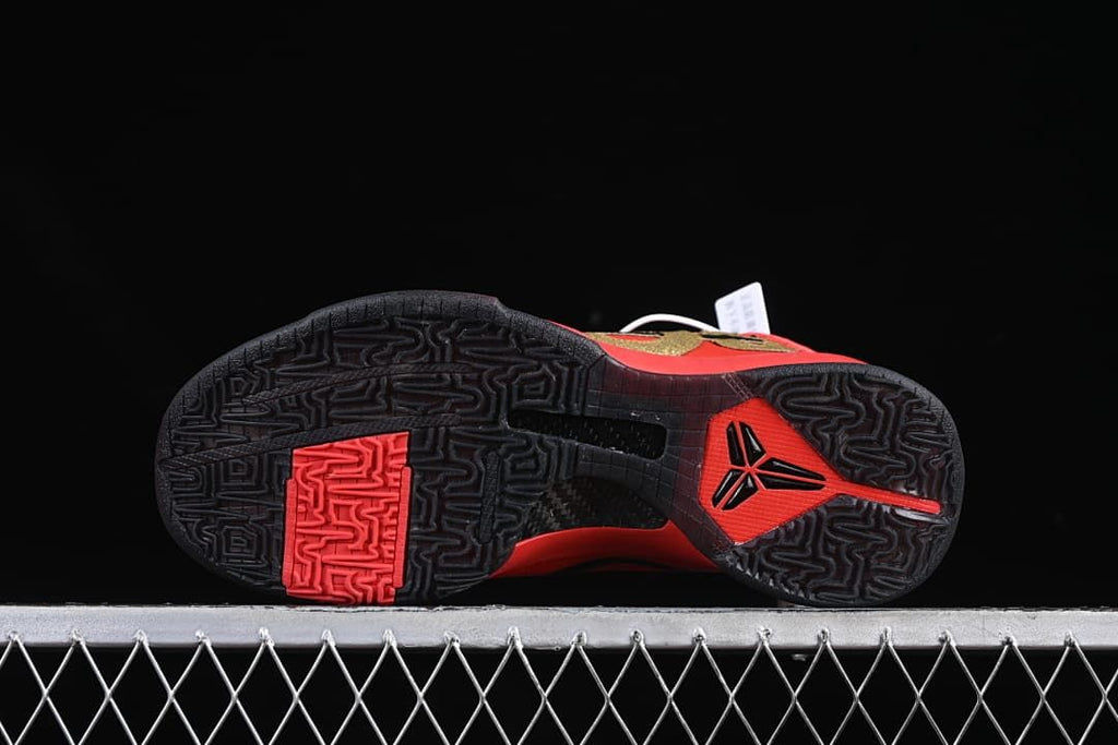 Black patterned outsole with red detailing