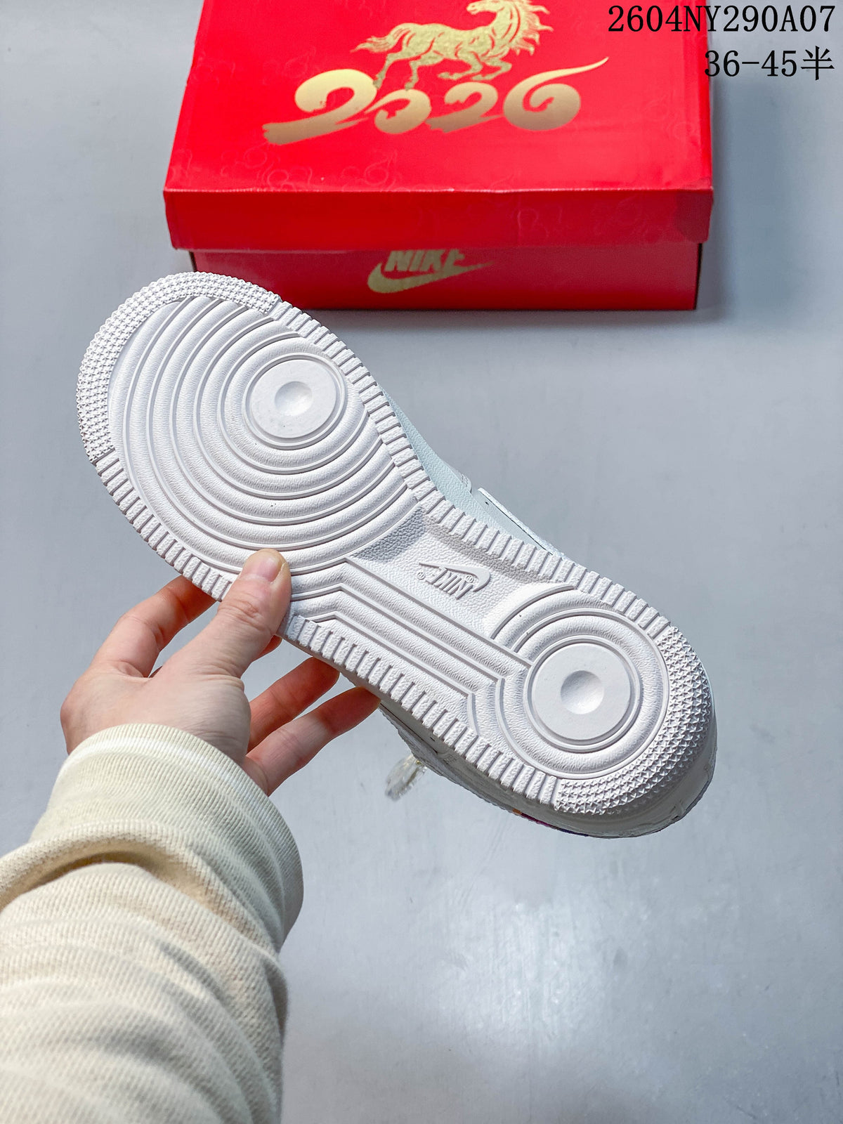 Underside of the white Air Force 1 shoe showing a patterned outsole; red box with gold horse artwork behind it