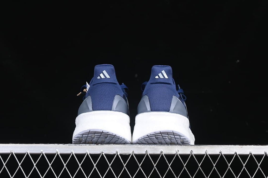 Rear view of the pair showing heel details and outsole tread.