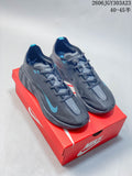 Pair of charcoal Nike Ava Rover low-top running shoes with blue accents