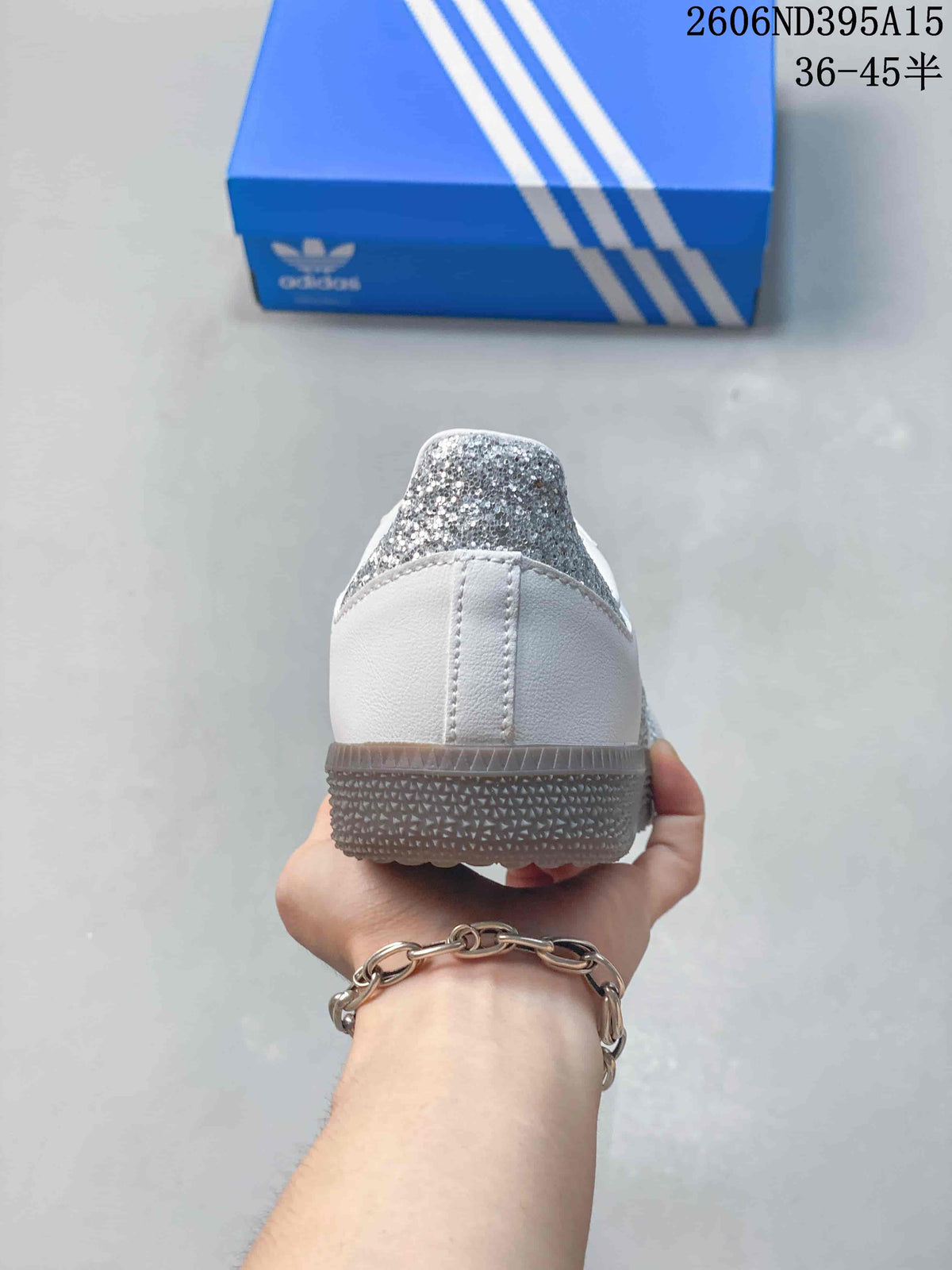 Rear view showing the silver glitter heel detail and textured outsole
