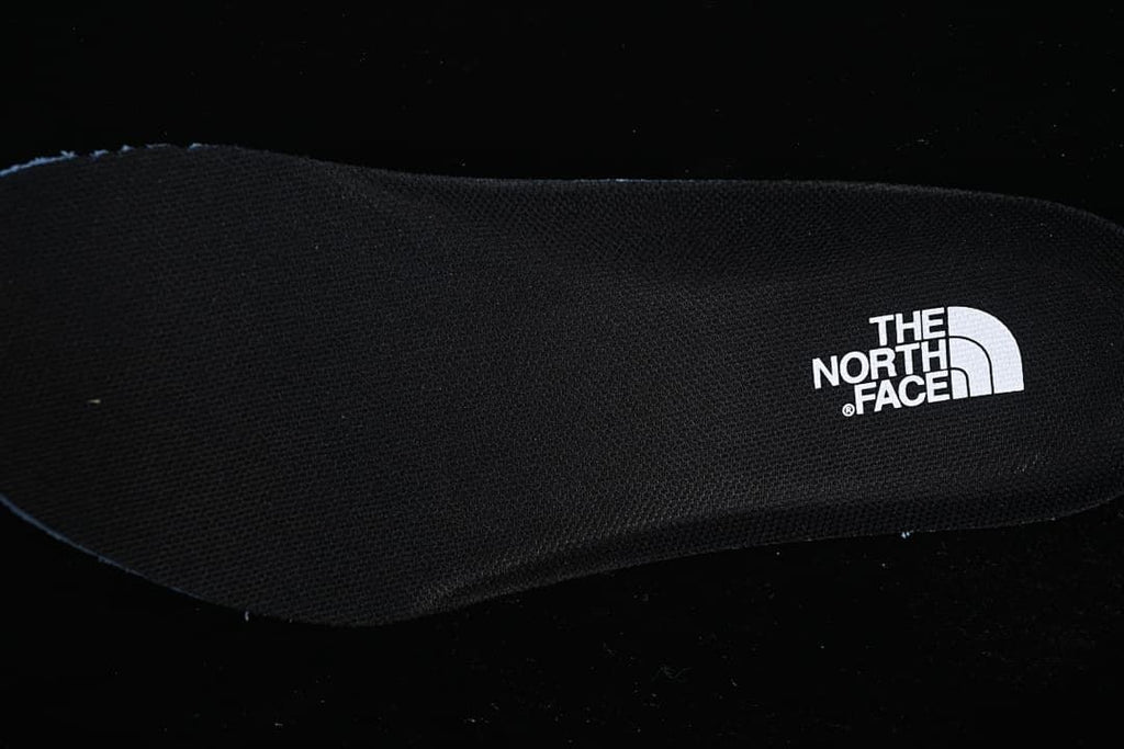 Close-up of the black footbed with The North Face branding