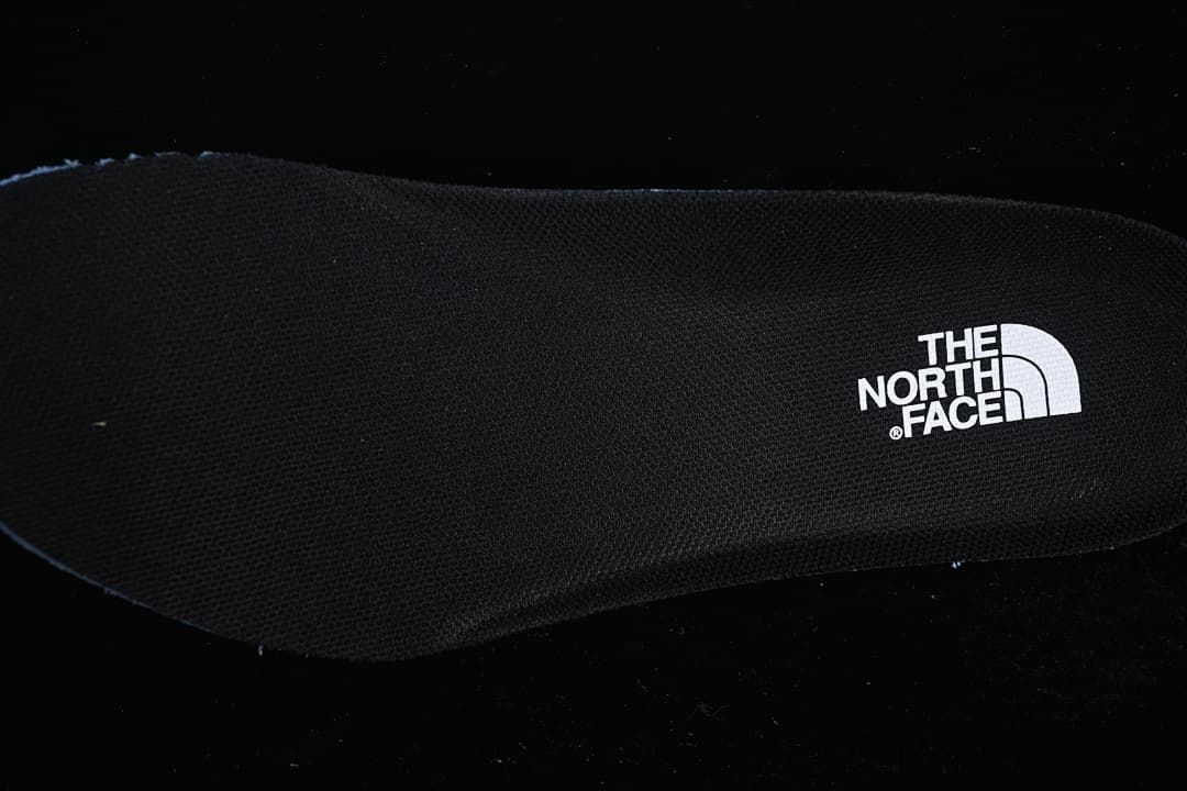 Close-up of the black footbed with The North Face branding