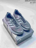 Pair of gray Adidas SL 72 Boost shoes displayed on a shoebox