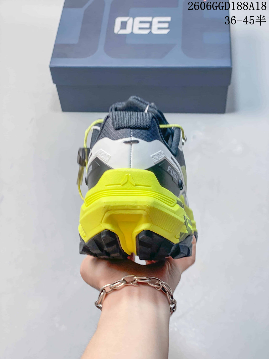 Rear view of a Kailas FUGA EX330 shoe showing a neon yellow heel and dark outsole; image text shows style code 2606GGD188A18 and size range 36–45.5.