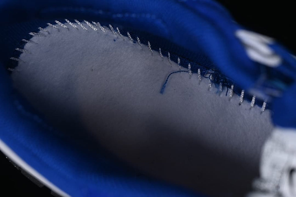 Close-up of the interior lining and stitching of a blue sneaker