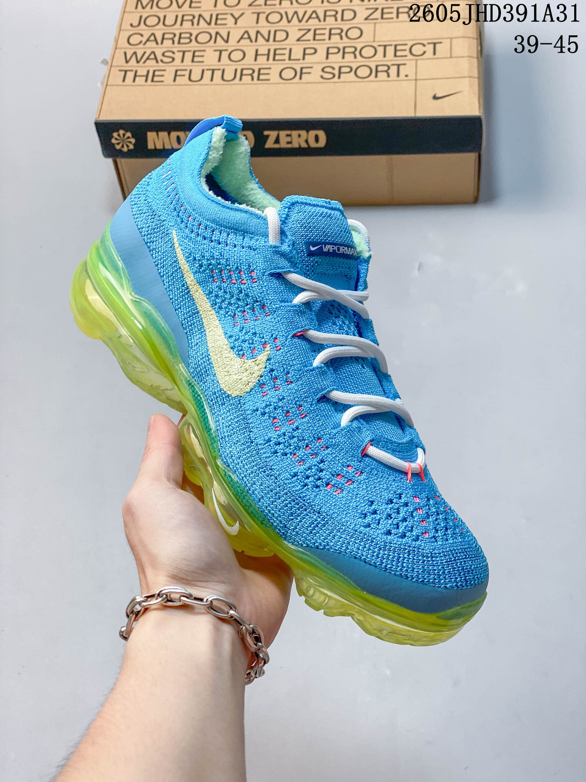 Bright blue Nike Air VaporMax 2023 Flyknit shoe with a yellow-green visible air-cushioned sole.