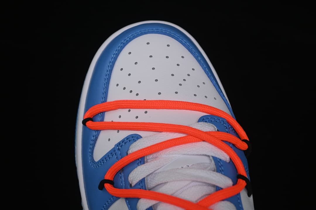 Top-down close-up of the perforated toe and layered laces.