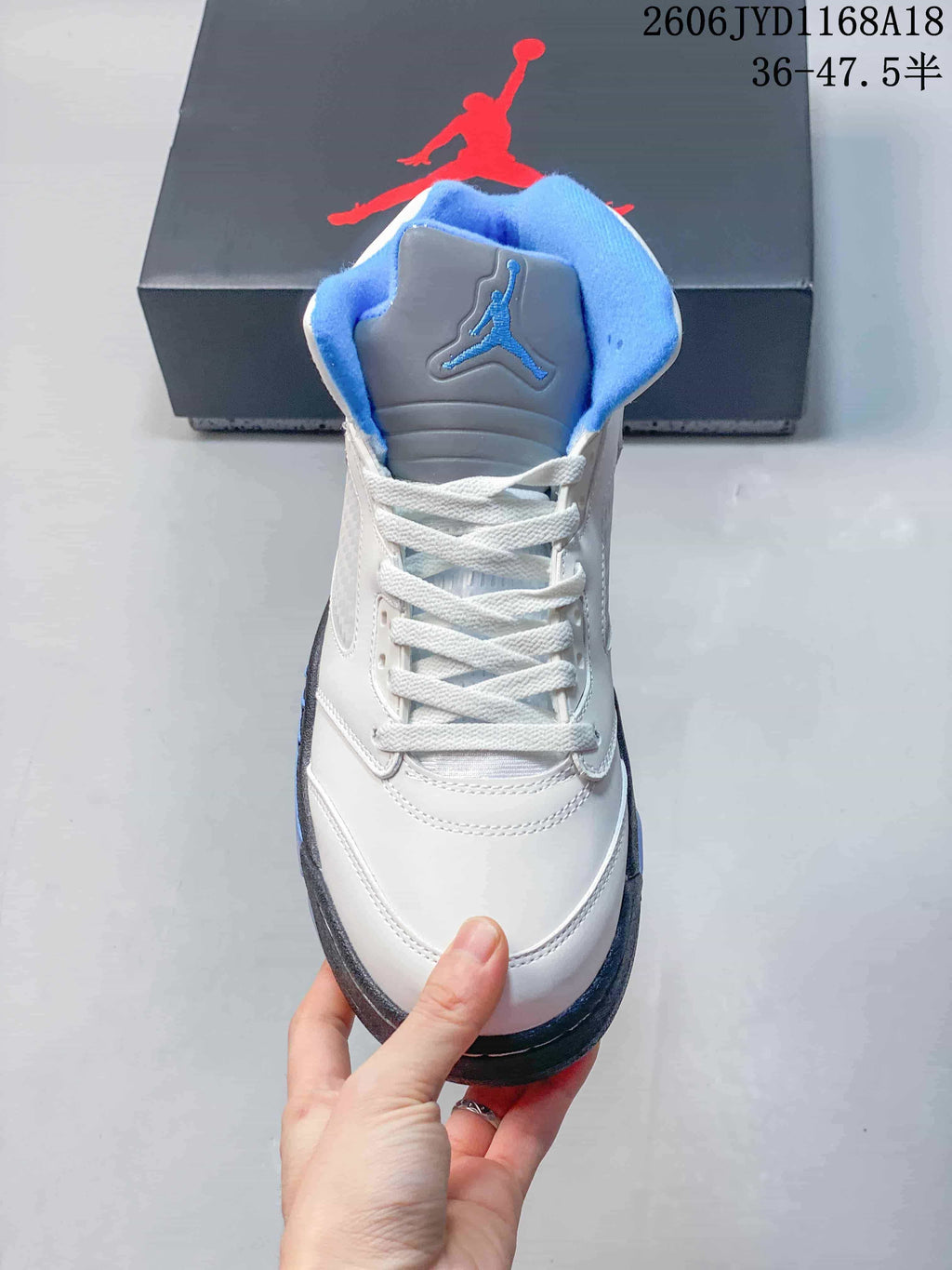 Front view showing the lace-up design and padded blue collar