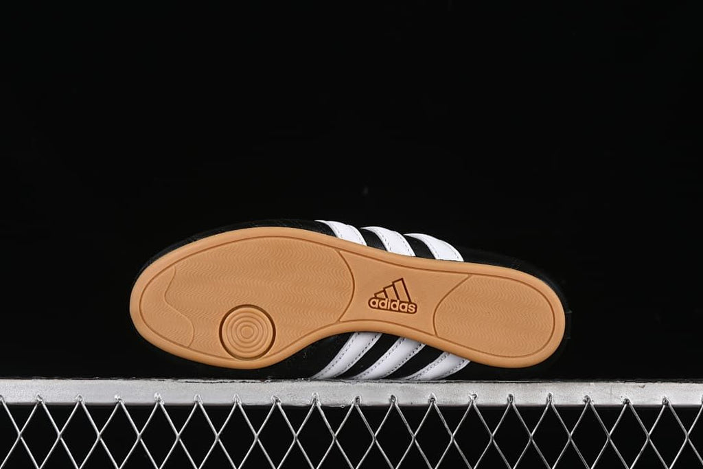 Outsole view showing the gum-colored tread and Adidas branding.