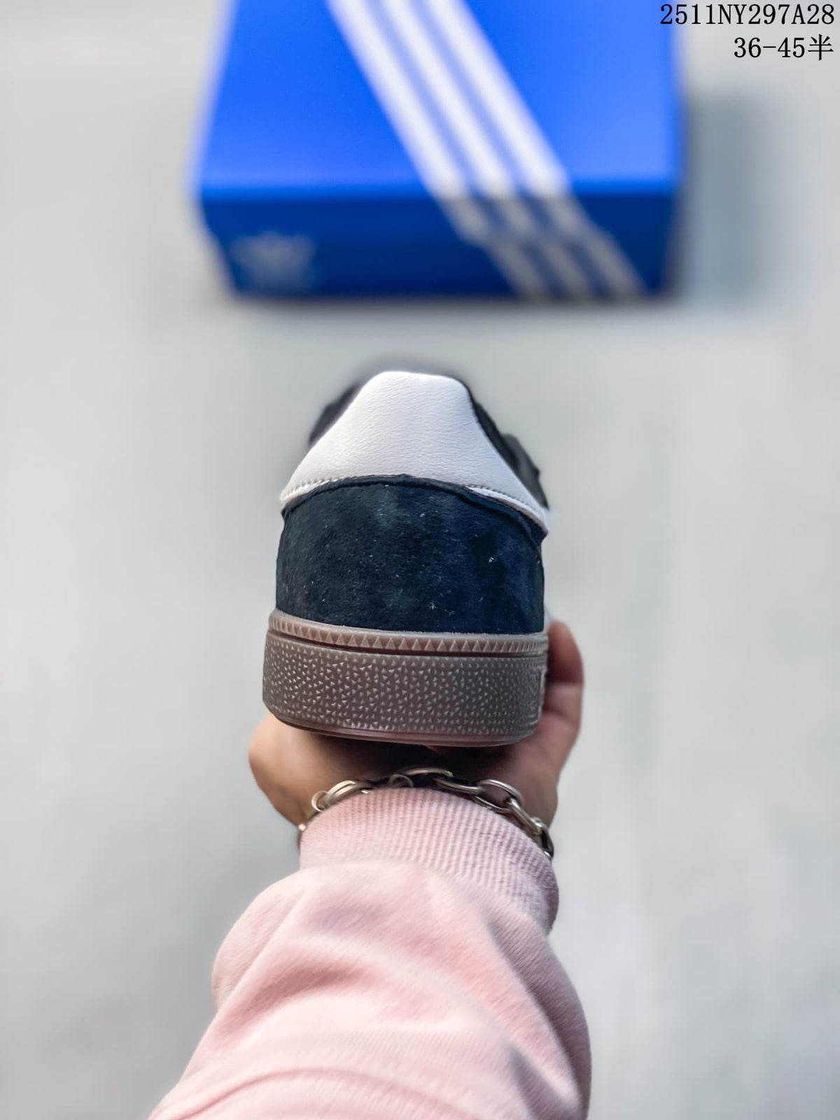 Rear view showing the dark heel and light heel tab above the brown outsole.