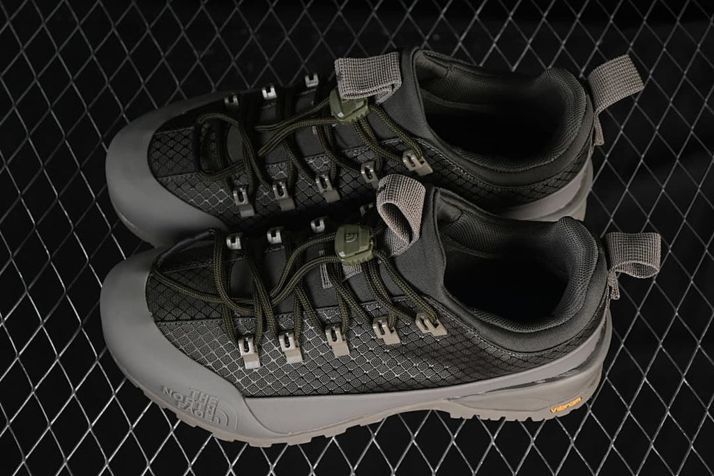 Pair of gray taupe low-cut sneakers viewed from above