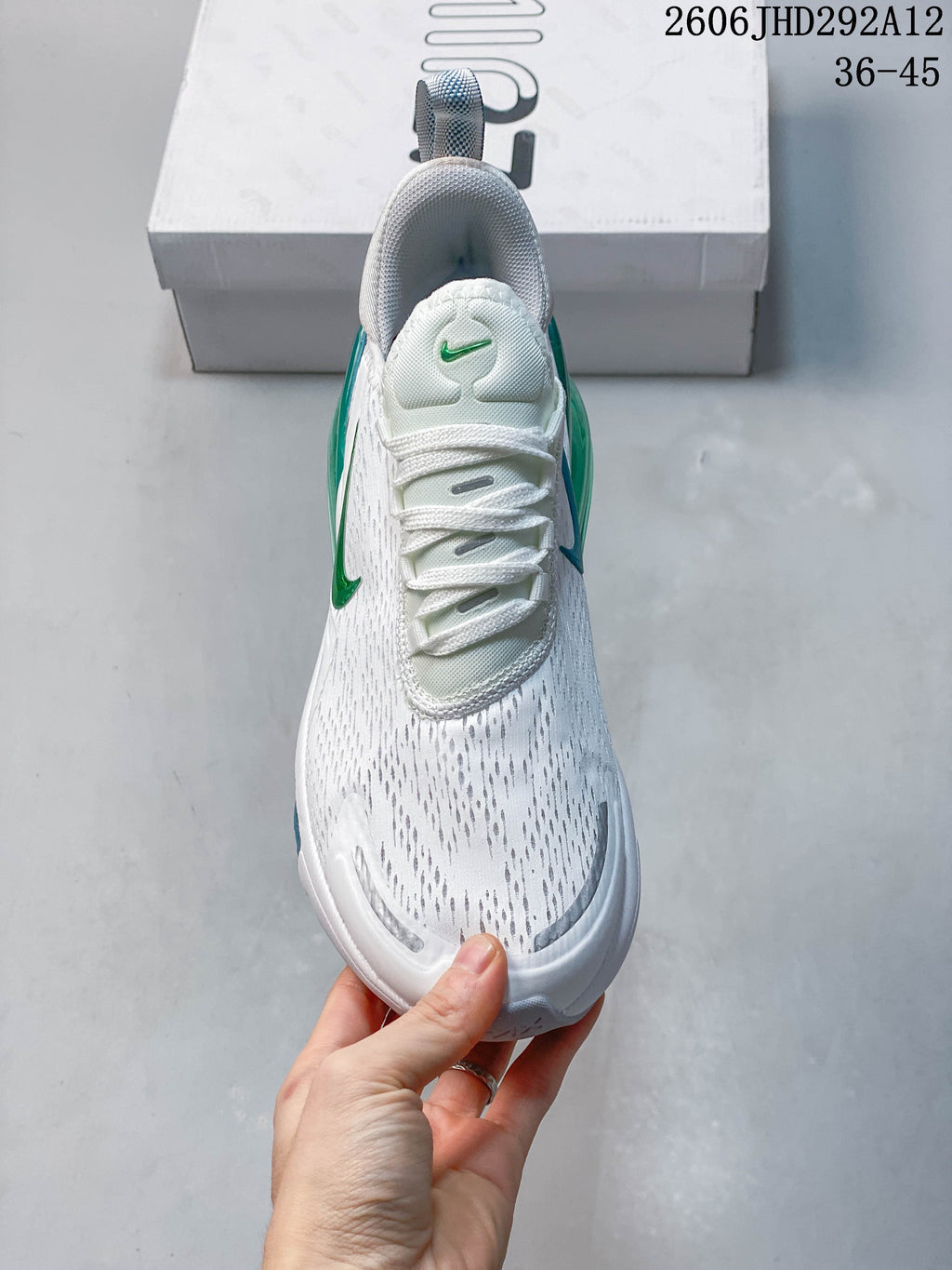 Front view of a white Nike Air Max 270 sneaker with lace-up closure