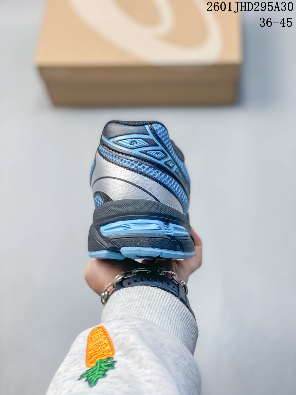 Rear view of the sneaker with layered heel details