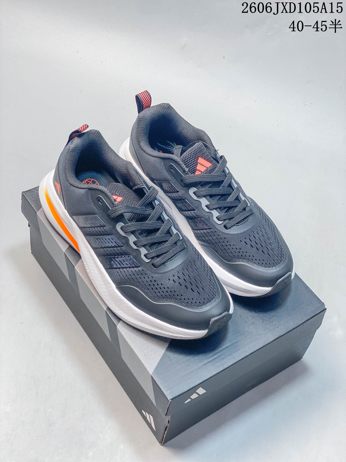 Pair of charcoal-gray Adidas Ultrabounce shoes with coral accents