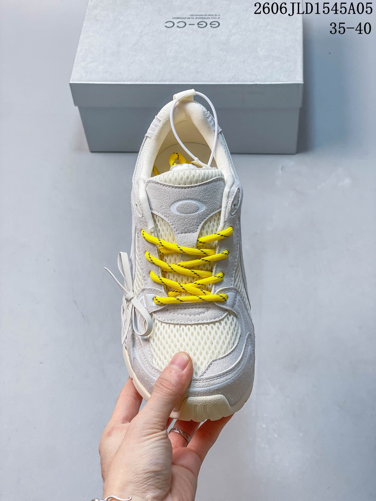 Top view of a sneaker with mesh sections and bright yellow laces