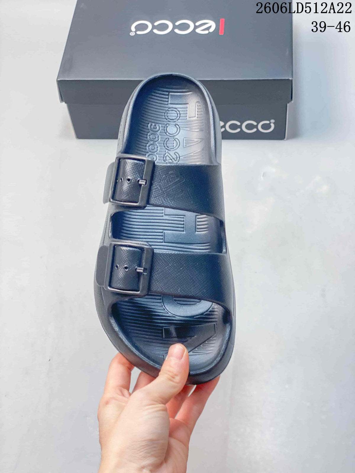 Top-down view of a dark gray sandal with two buckle straps and a textured footbed; image displays style code 2606LD512A22 and sizes 39–46.