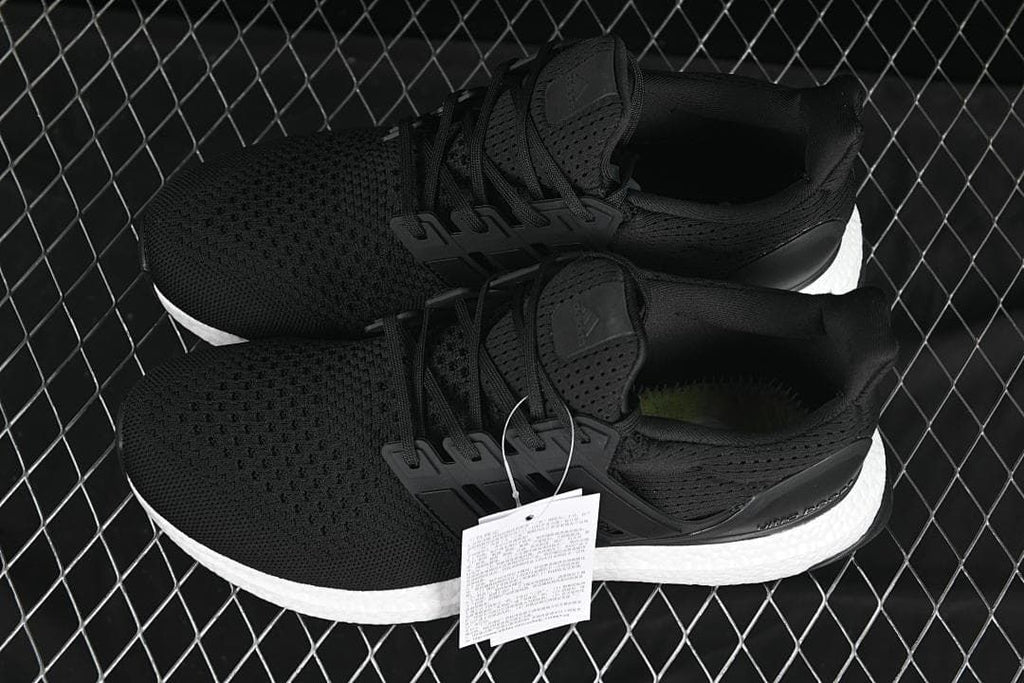 Pair of black UltraBoost 1.0 shoes displayed from above.