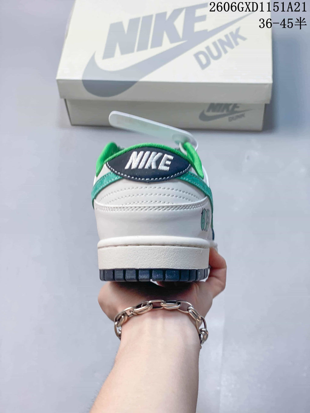 Rear view of the sneaker showing the heel and green collar lining