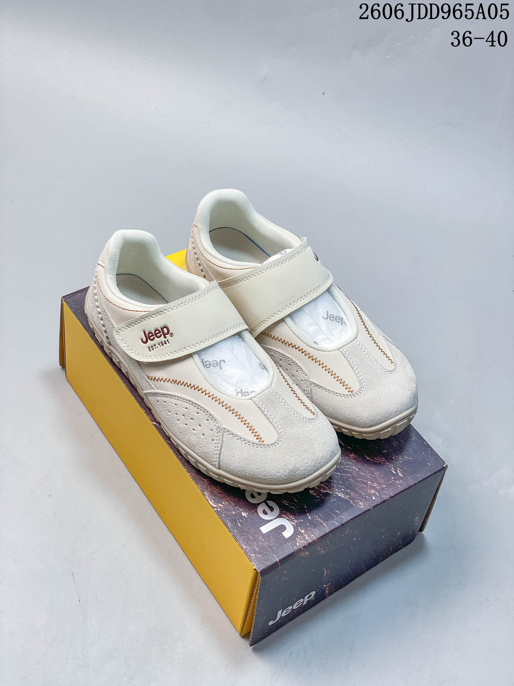 Pair of cream Jeep Mary Jane casual shoes shown on a shoe box
