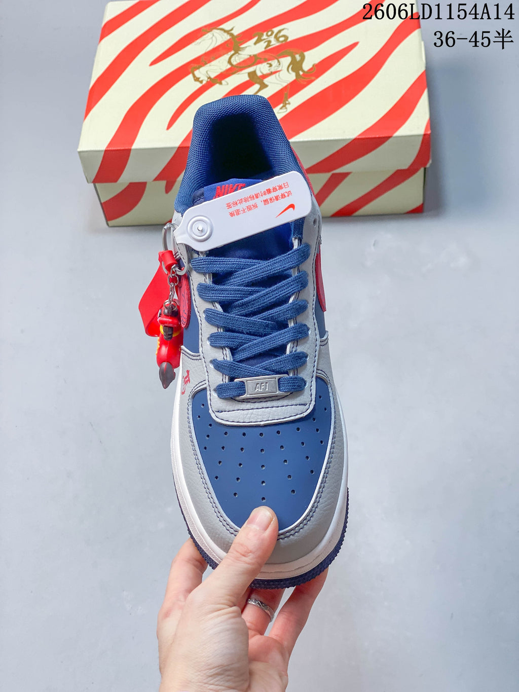 Top view of a Nike Air Force 1 ’07 Low sneaker showing its perforated blue toe and blue laces.