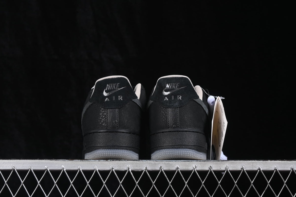 Rear view of the pair showing Nike Air heel branding and translucent-looking outsoles.