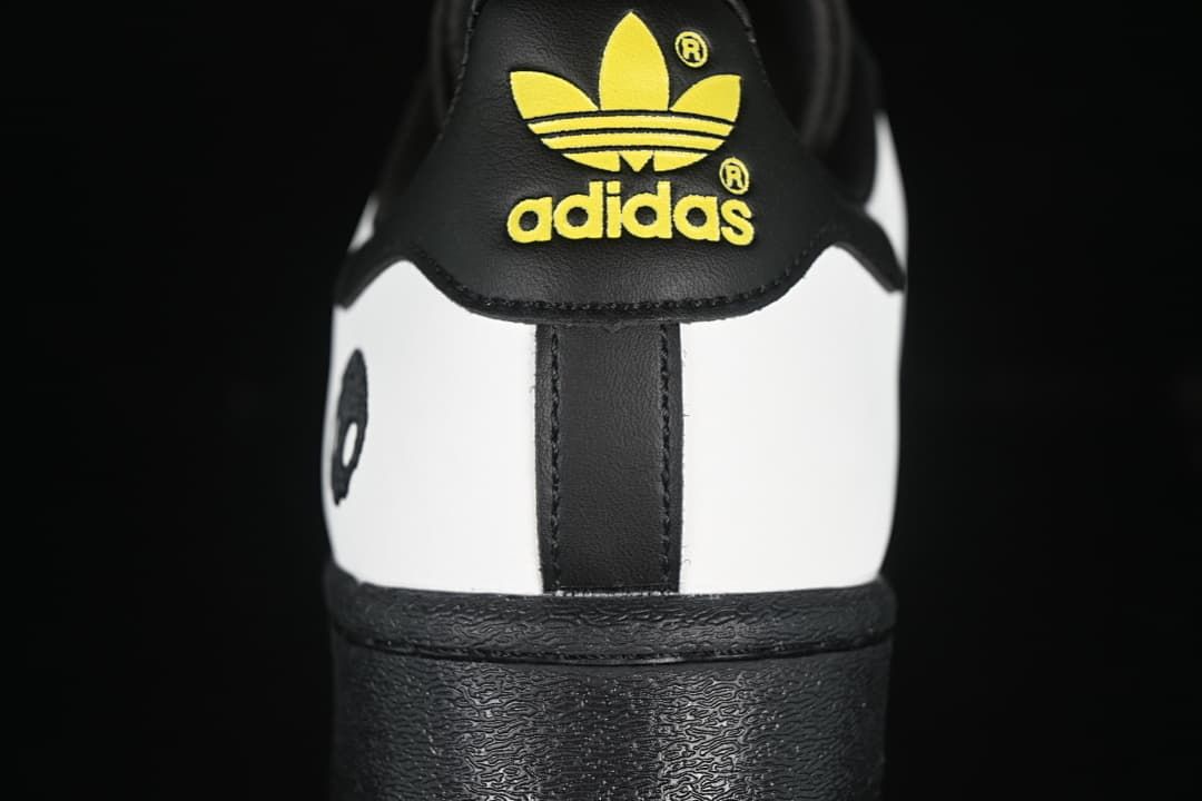 Rear view with yellow adidas Trefoil branding on the heel