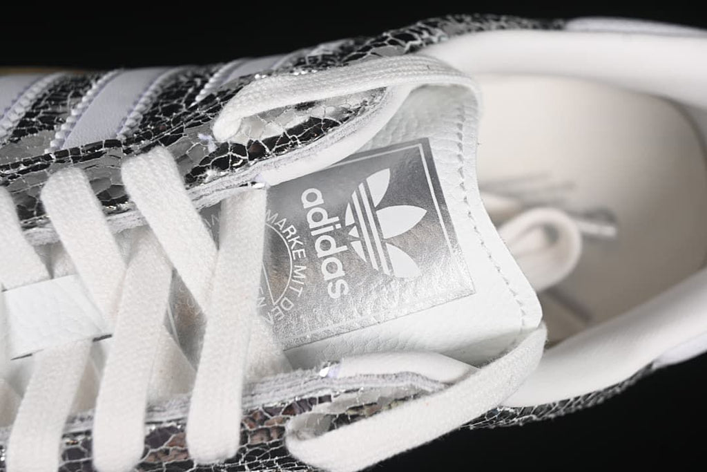 Close-up of the tongue, laces, and adidas branding