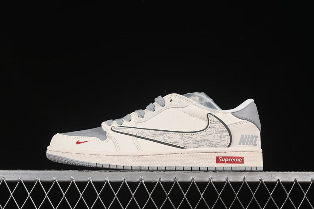 Side view of a grey and off-white low-top sneaker with a patterned side overlay