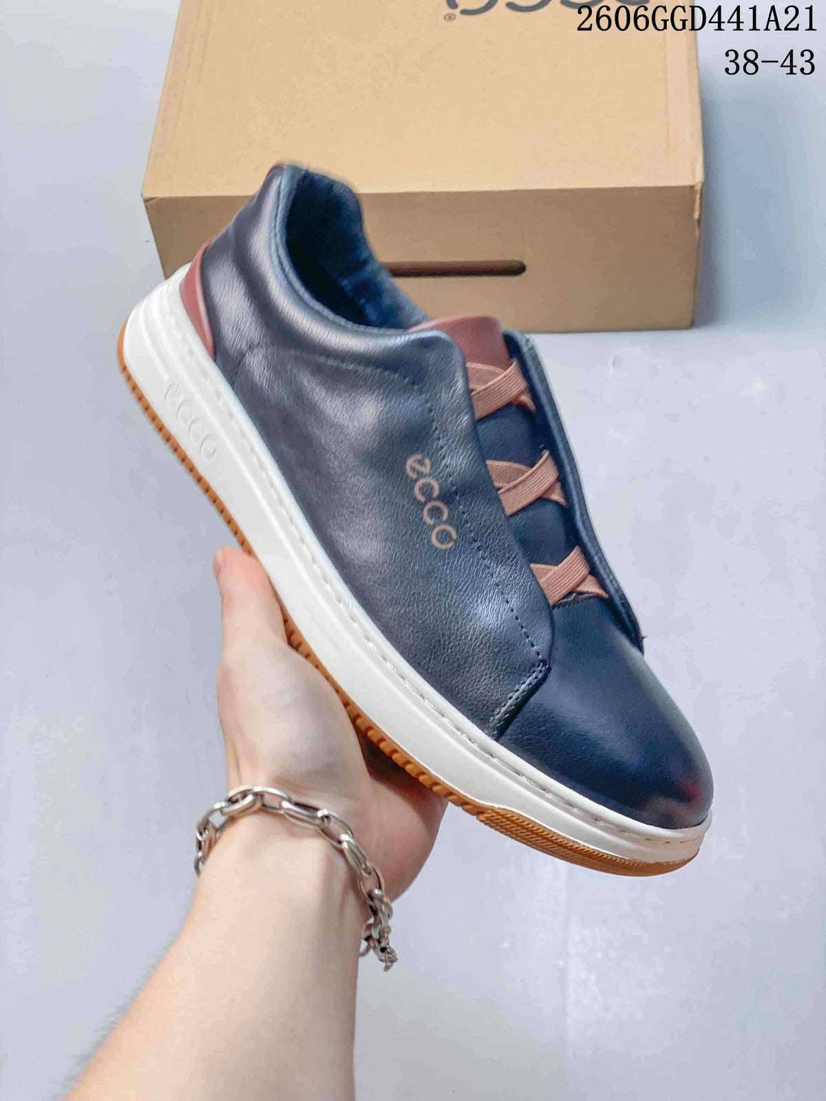 Angled side view of a navy ECCO sneaker with brown accents and a white midsole.