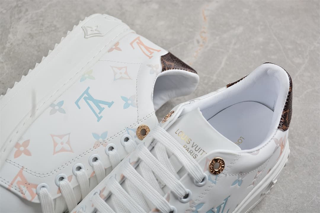 Close-up of patterned upper, heel panel, laces, and tongue