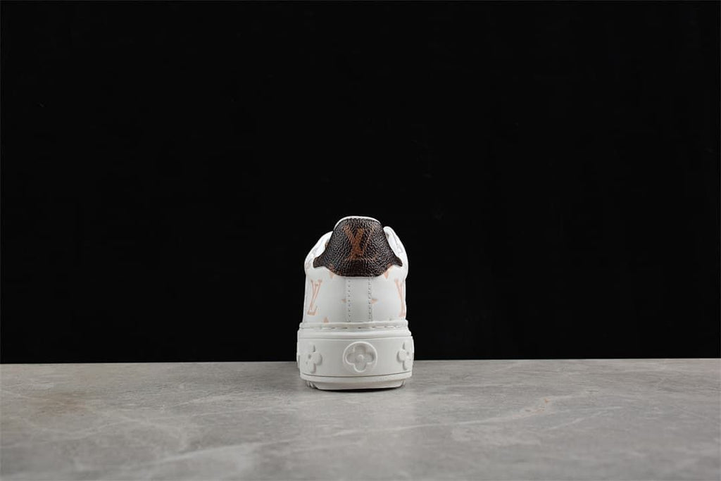 Rear view showing dark patterned heel panel and raised sole