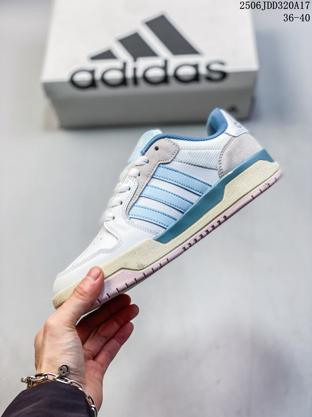 Side profile of a white adidas Entrap sneaker with light blue stripes and a pink outsole.