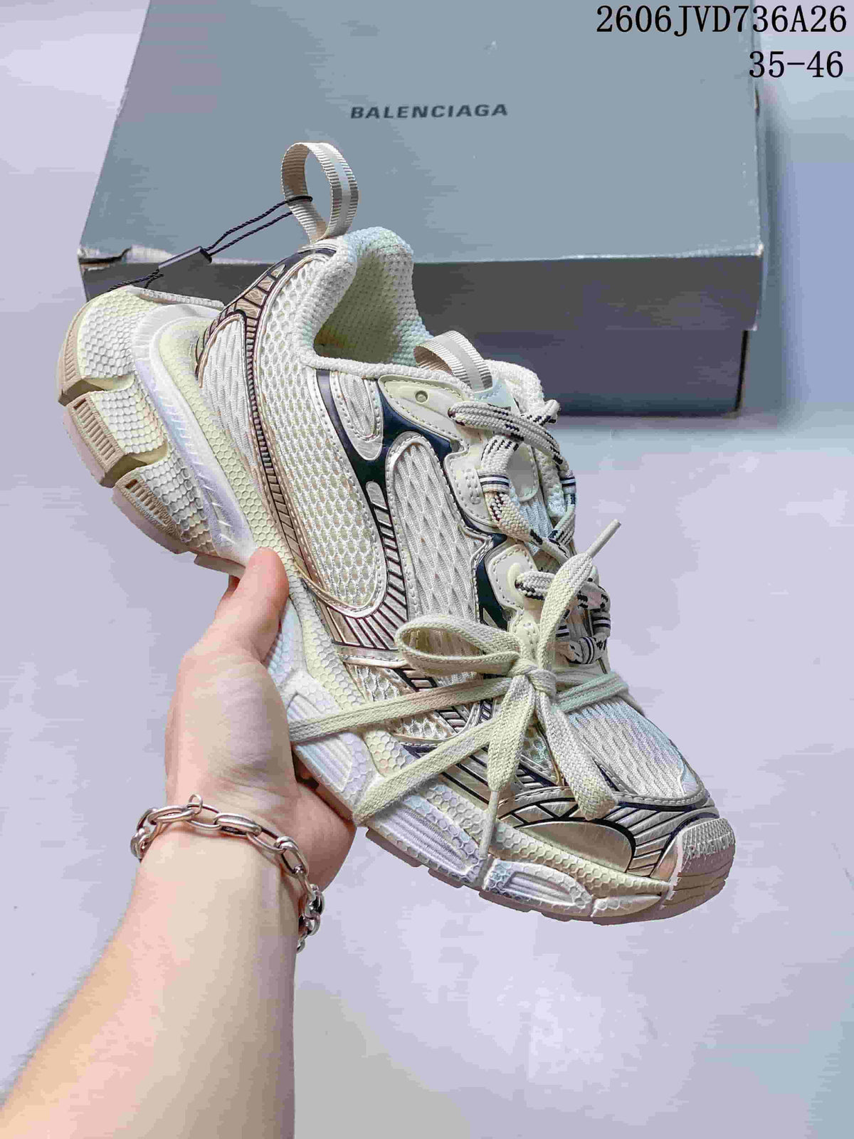 White Balenciaga 3XL sneaker with dark metallic layered accents