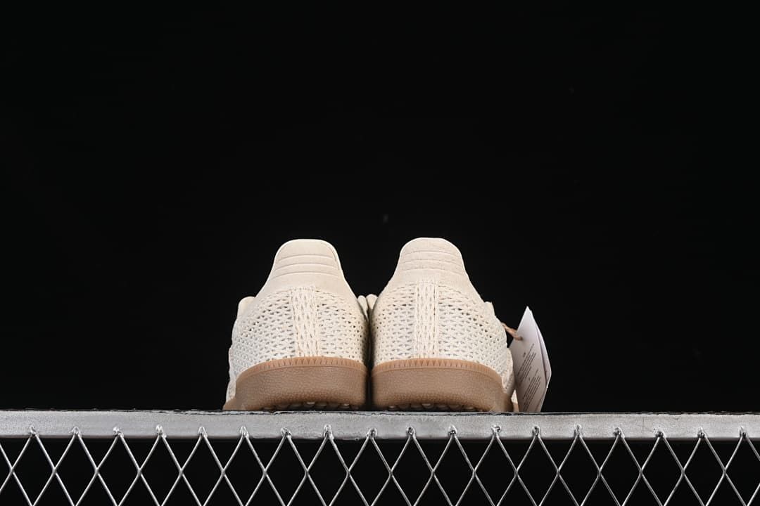 Rear view of both sneakers, showing the textured heel panels and gum-tone soles.