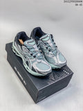 Pair of silver and mint ASICS Gel-Nimbus 10.1 sneakers on a shoebox