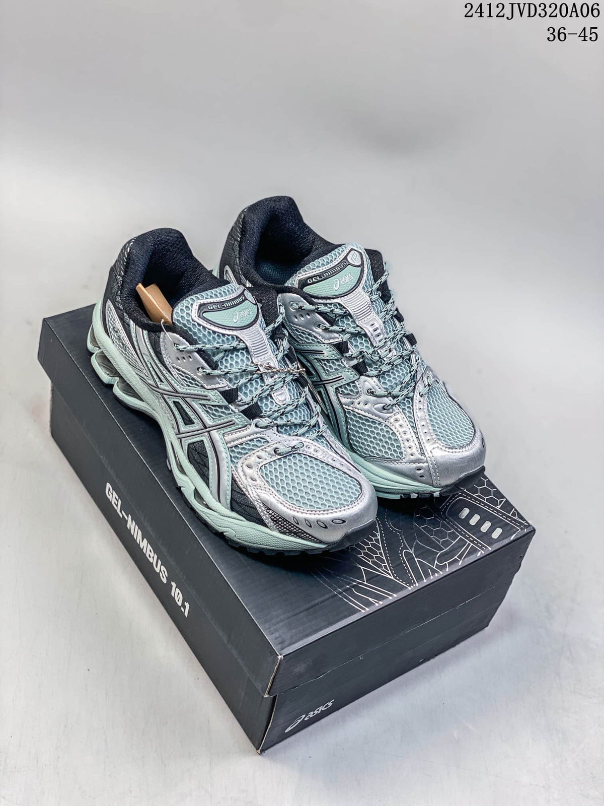 Pair of silver and mint ASICS Gel-Nimbus 10.1 sneakers on a shoebox
