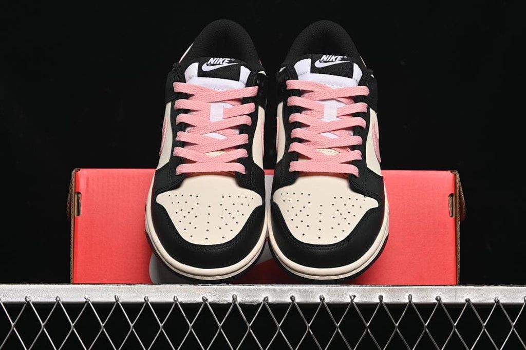 Front view of the pair with perforated toes and pink laces